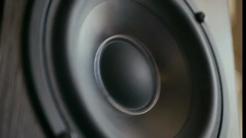 Close up of a vibrating audio speaker cone Stockbeeldmateriaal 347722436