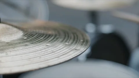 Close up of a vibrating cymbal on a drum set during a live music performance Видео 338418557