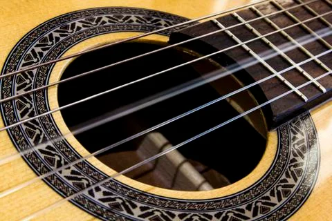 Close up on a vibrating string of a guitar Stock Photos
