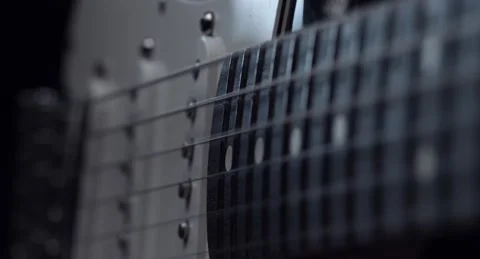 Close-up of vibrating strings on a guitar Video stock 153918337