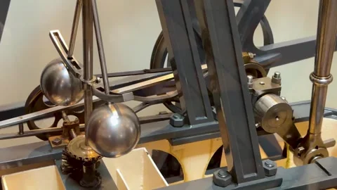 Close Up of Victorian Steam Engine Model with Rotating Centrifugal Governor Stock Footage 336704901