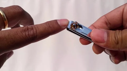 Close Up Video Of An Asian Man Cutting Finger Nails With Nail Cutter Stock Footage 267873013