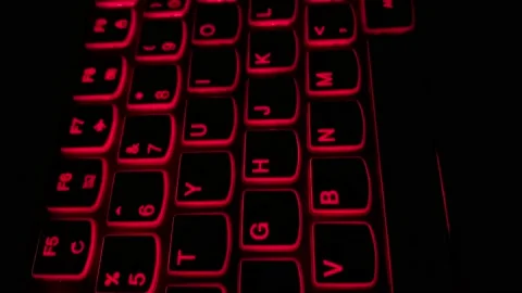 Close up video - Back lit laptop keyboard buttons. Stock Footage 150708032