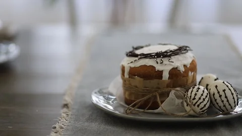 Close-up, video background, Easter bread on a plate with three eggs, copy space 스톡 동영상 128228018