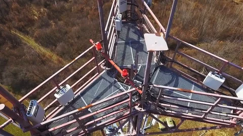 Close up video of Base transceiver station tower (BTS) on green meadow Stock Footage 88193315