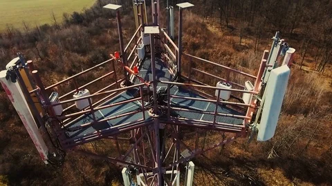 Close up video of Base transceiver station tower (BTS) on green meadow Stock Footage 88193529