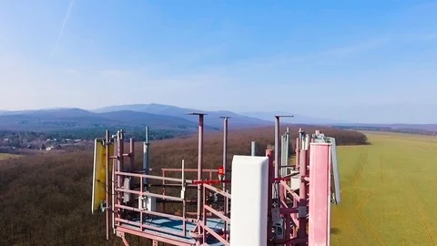 Close up video of Base transceiver station tower (BTS) on green meadow Stock Footage 88278861