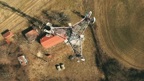 Close up video of Base transceiver station tower (BTS) on green meadow. Stock Footage 88279398