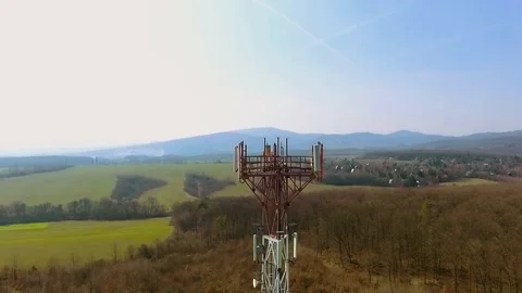 Close up video of Base transceiver station tower (BTS) on green meadow Stock Footage 88280740