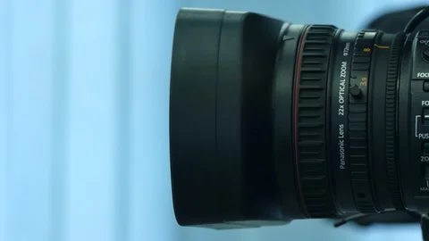 Close-up of a video camera during a television broadcast. The cameraman adjus Stock Footage 93830915