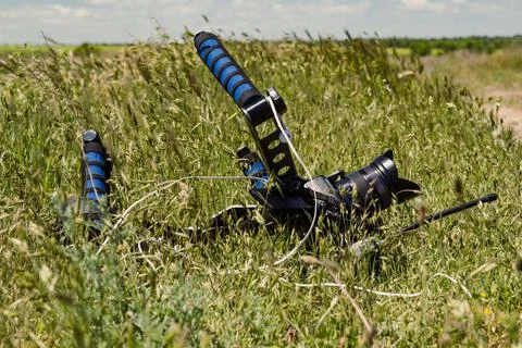 Close up video camera laying in grass concept photo Stock Photos