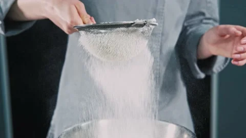 Close up video of chef sifting flour in kitchen for preparing dough for bread Stock Footage 219505213