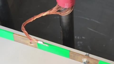 Close up video of a copper shield ground wire fitted with a metal terminal. Stock Footage 339049334