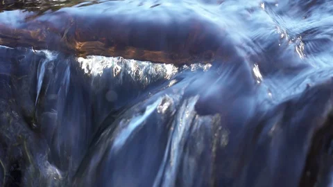 Close up video of crystal clear water running in mountain forest creek. Stock Footage 124705388