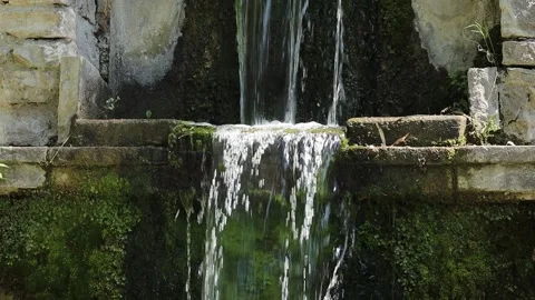 Close up video of crystal clear water falling from the mountain. Water falls Stock Footage 217397249