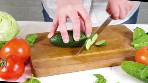 Close-up video of cutting cucumbers Stock Footage 170434693