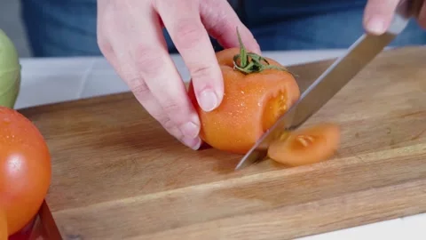 Close-up video of cutting tomatoes Stock Footage 170434684