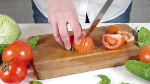 Close-up video of cutting tomatoes Stock Footage 170434685