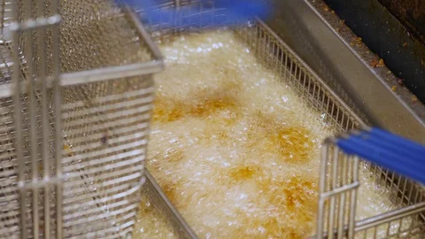 Close up video of deep fryer in the boiling oil Stock Footage 127601782