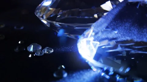 Close-up video diamonds shining and rolling. Stock Footage 89558346