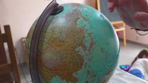Close-up video of the didactic use of the rotating globe Stock-Footage 241104636