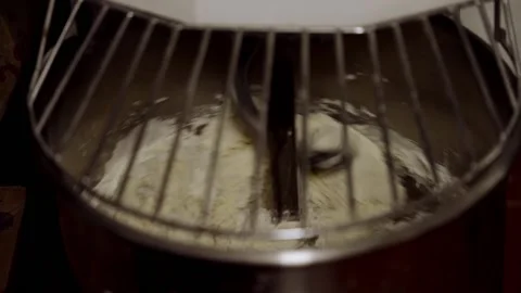 Close up video of dough being mixed in machine Stock-Footage 166919733
