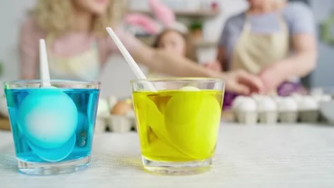 Close up video of drinking glasses with dyes for coloring eggs  Shot with RED he Video stock 148483380