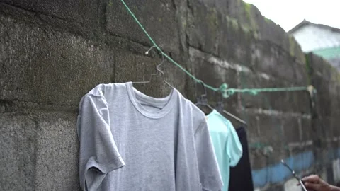 Close-up video of drying clothes in a crowded area. Stock Footage 145958537
