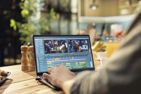 Close up, video editor working remotely, editing multimedia content Stock Photos