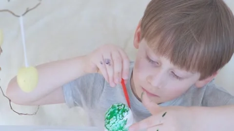 Close up video of the egg painting process. Stock Footage 149870963