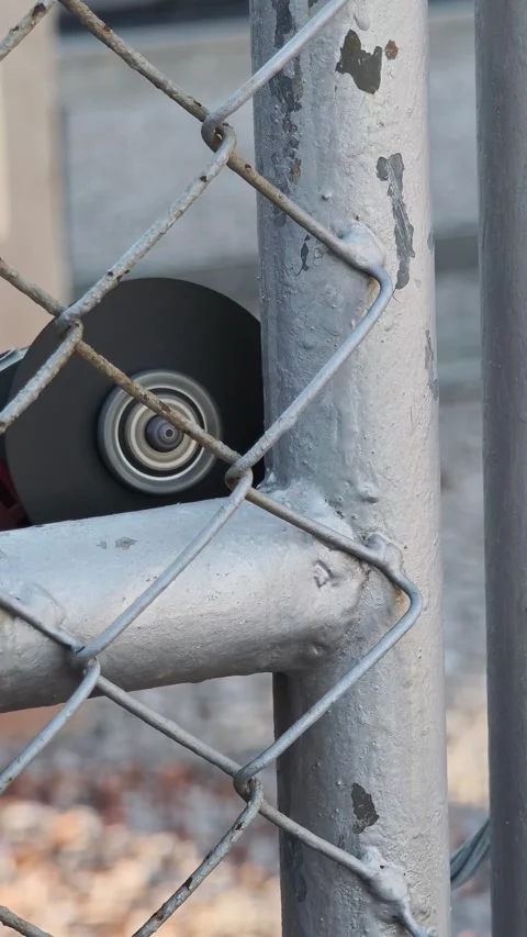 Close up video of electric angle grinder wheel cutting galvanized steel pip. Stock Footage 338175410
