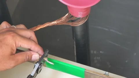 Close up video of electrician hand using a tool to crimp a metal terminal. Stock Footage 339049357