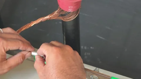 Close up video of electrician hands attaching a metal terminal lug. Stock-Footage 339049329
