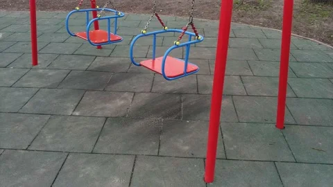 Close-up video of empty swings on playground Stock Footage 153630987