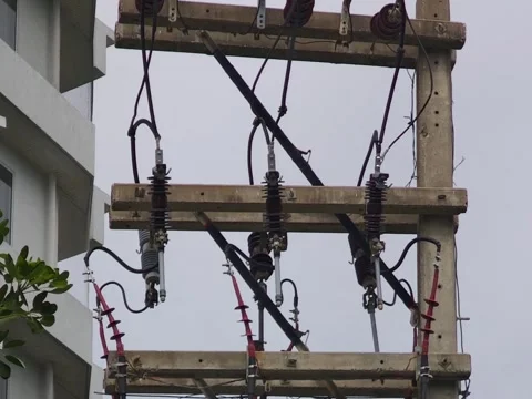 Close up video of engaging high voltage drop out fuse cutouts on a concrete. Stock Footage 338298352