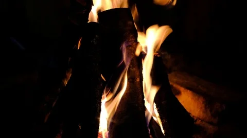 Close up video of fire burning in the fireplace. Video of fire flames over da Stock Footage 99726243