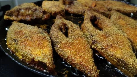 Close Up Video of Fish Frying in Hot Oil in Frying Pan Stock Footage 339685849
