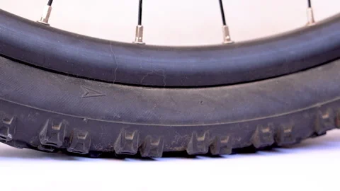 Close-up video of a flat bicycle tire being inflated, focusing on the lower.. Stock Footage 310259917