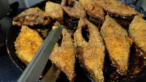 Close Up Video of Flipping Fish While Frying in Hot Oil Pan Stock Footage 339689481