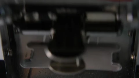 Close-up video footage of automatic page numbering process Stock Footage 327987475