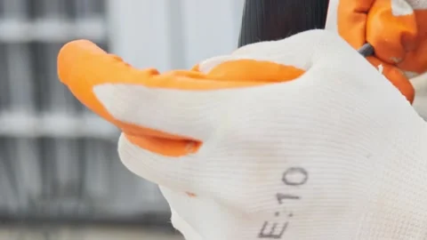 Close up video of gloved hands using a round file to smooth . Stock Footage 339049296