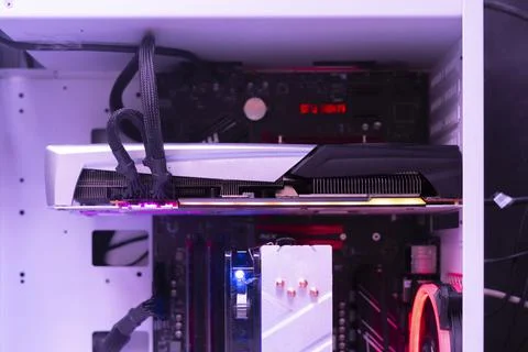 A close up video graphics card inserted in the computer Stock Photos