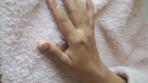 Close up video of hand touching soft pink furry blanket, soothing tactile e.. Stock Footage 332268598