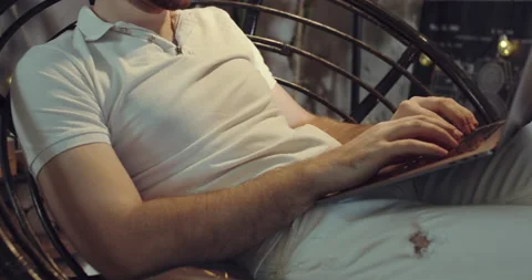 A close-up video of the hands of a man typing something on his laptop Stock Footage 135113831
