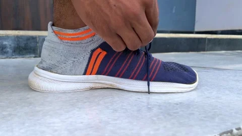 Close Up Video of Hands Tying Shoe Laces on Sneakers Stock Footage 315337986