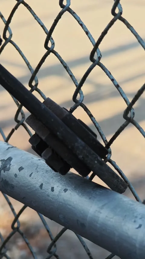 Close up video of heavy duty bolt cutter tool snapping chain link wire. Stock Footage 338175428