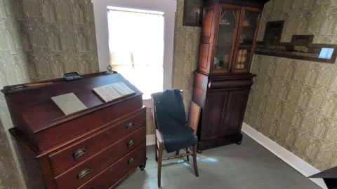 Close-up video of a historic room showcasing gold-patterned wallpaper Stock Footage 336264379