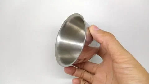 Close-up video of holding a small stainless steel bowl Stock Footage 253253636