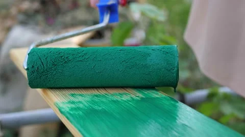 Close up video of human hand paints an old wooden board with green paint Stock Footage 140254835