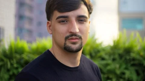 Close up video inspired young man bearded looking at camera. Video stock 265197030
